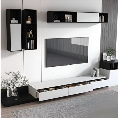 Modern living room setup with a TV and wall-mounted shelves.