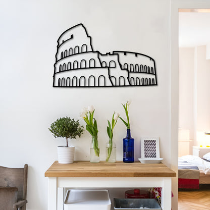 Wall decal of the Colosseum on a white wall above a wooden table with decorative items.