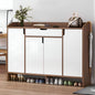 Wooden shoe cabinet with mirrored doors and shoes underneath, in a room setting.