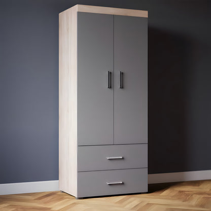 Tall gray wardrobe with wooden top against a dark wall.