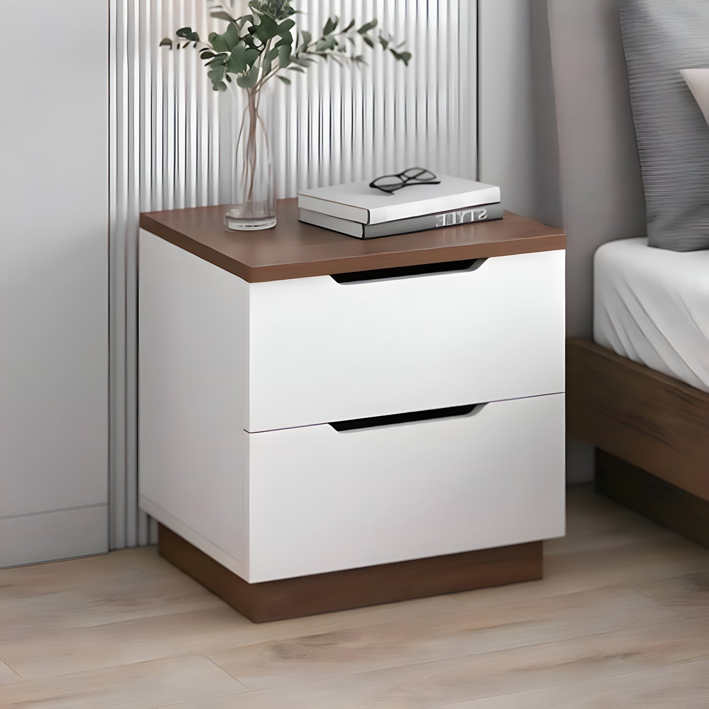 White nightstand with wooden top and base in a bedroom setting