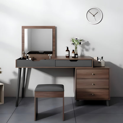Wooden vanity table with mirror, stool, and decorative items on a gray floor.