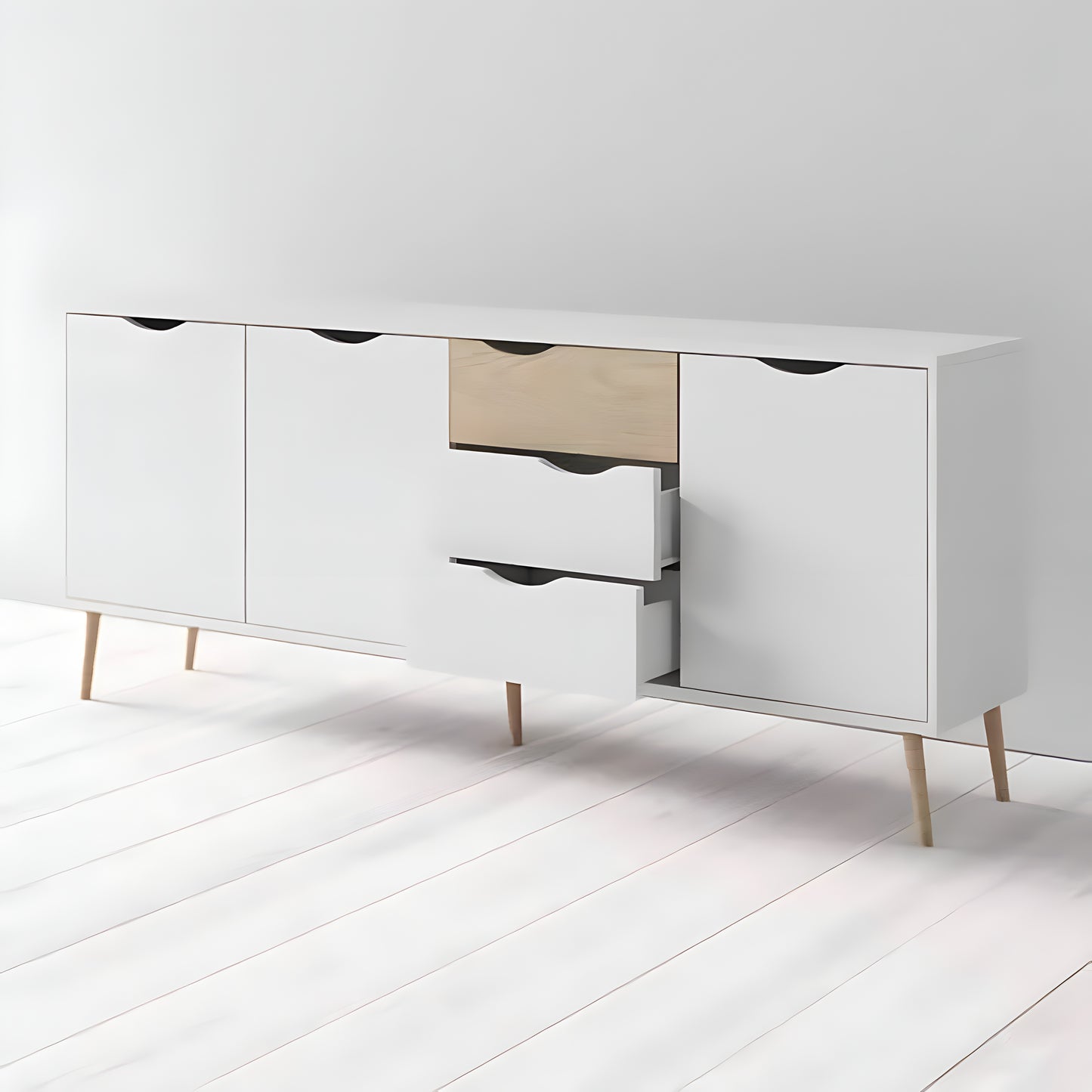 White dresser with wooden legs on a white floor and background