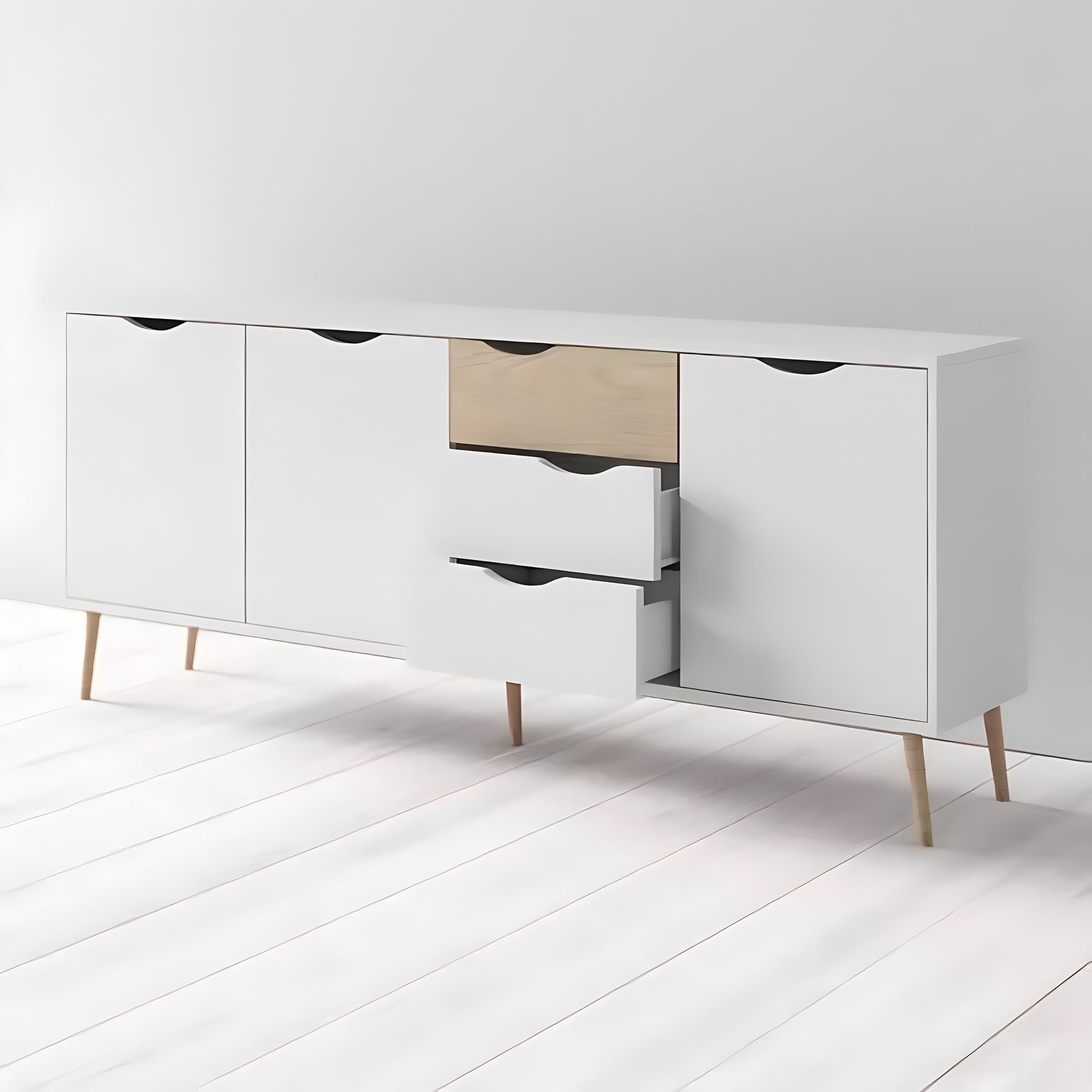 White dresser with wooden legs on a white floor and background