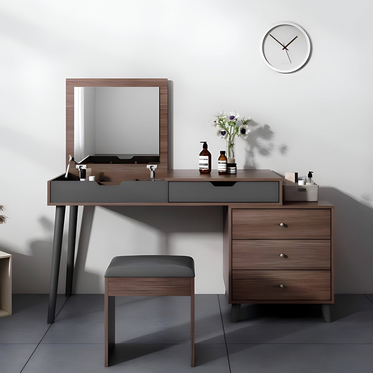 Wooden vanity with mirror, stool, and decorative items on a white wall background