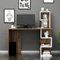 Wooden desk with a computer setup against a gray wall with framed artwork.