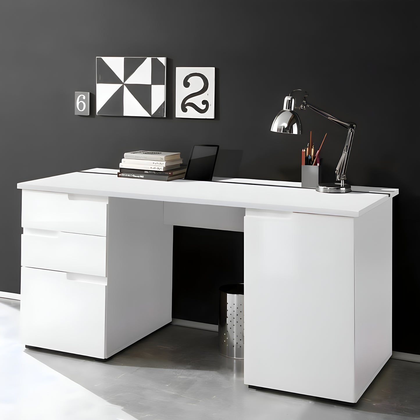 White office desk with a black wall and decorative elements