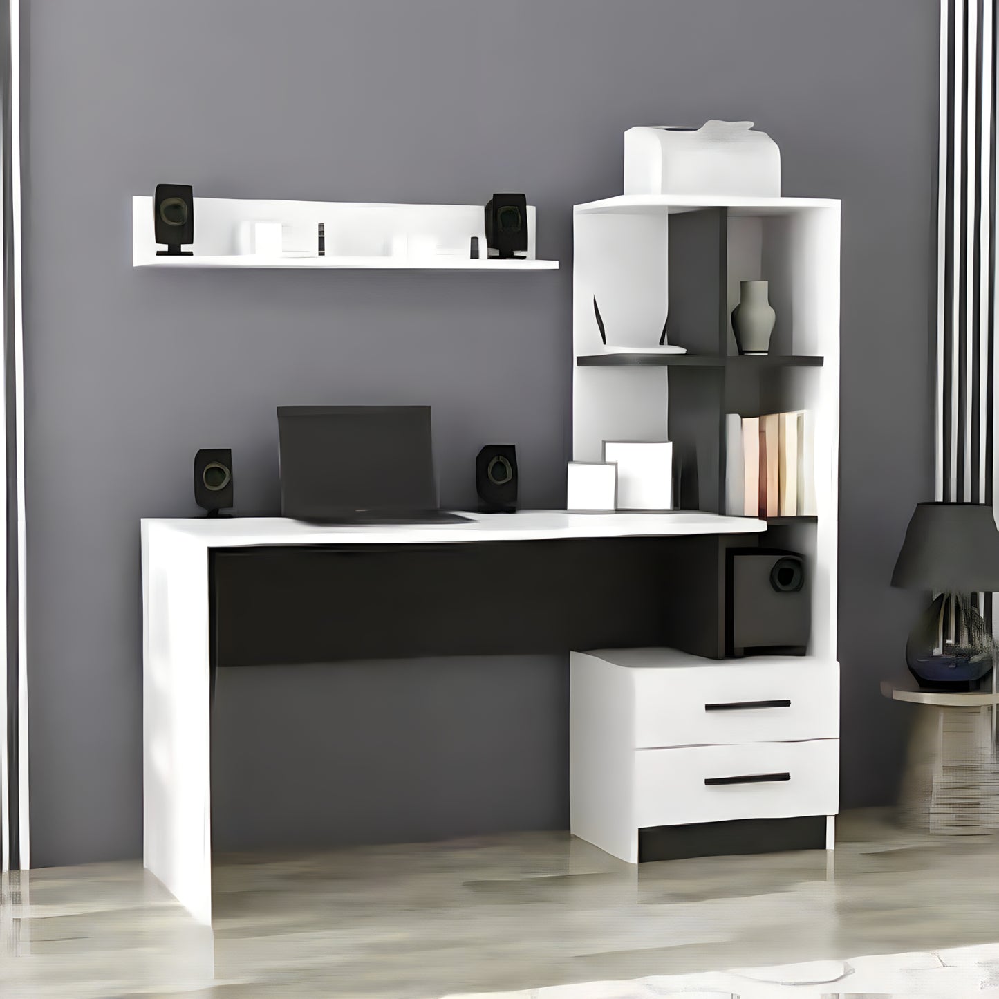 Modern office setup with a white L-shaped desk, shelves, and computer equipment against a gray wall.