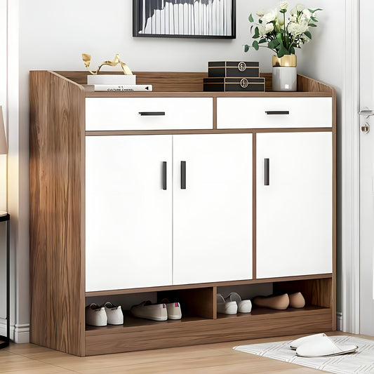 Wooden shoe cabinet with white doors and shelves on a wooden floor.