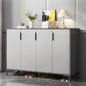 Modern shoe cabinet with shoes underneath in a stylish room setting.