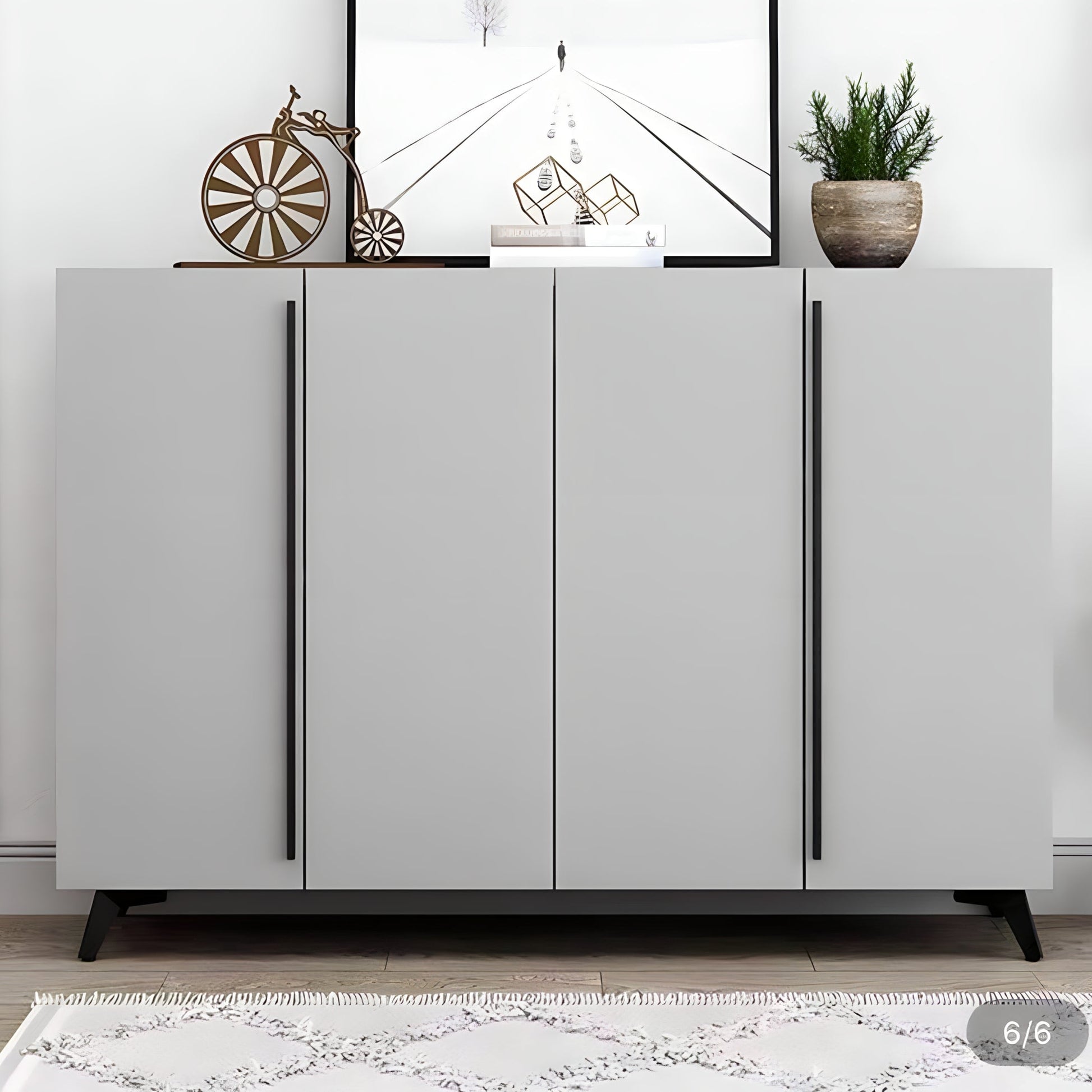 Gray sideboard with decorative items in a room setting