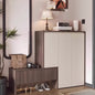 Modern interior with a shoe cabinet, mirror, and decorative items.