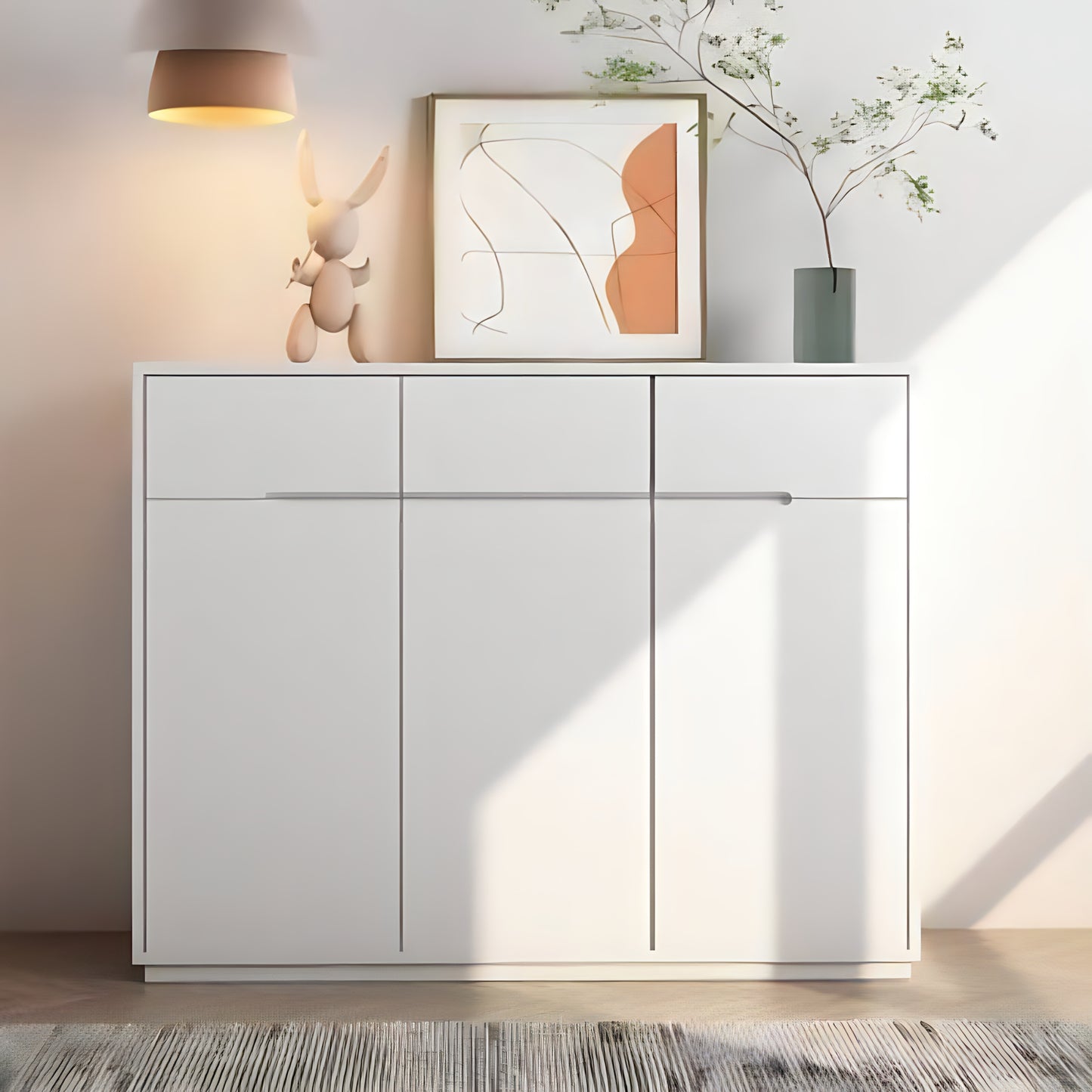 White cabinet with decorative items in a room setting
