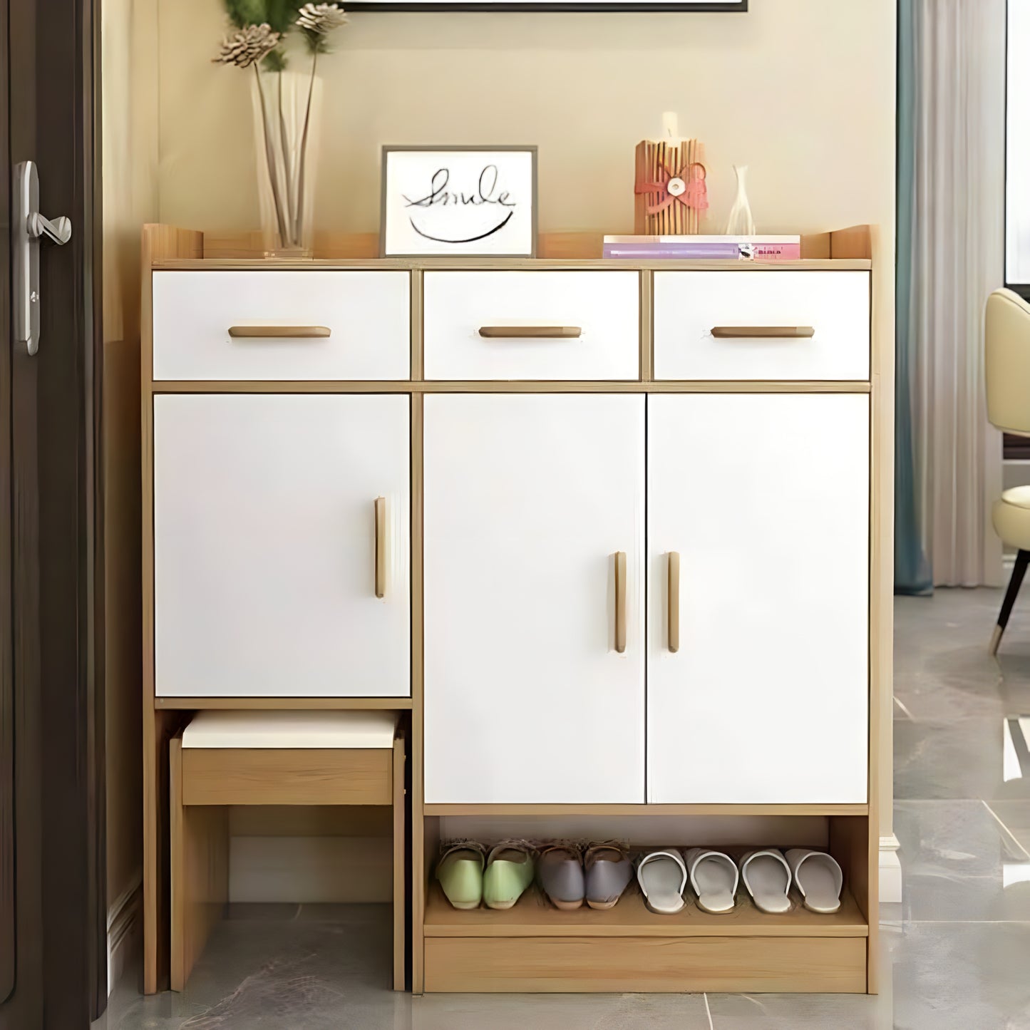 White shoe cabinet with wooden accents in a room setting
