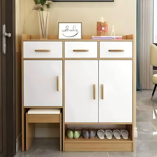 White shoe cabinet with wooden accents in a room setting