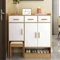 White shoe cabinet with wooden accents in a room setting