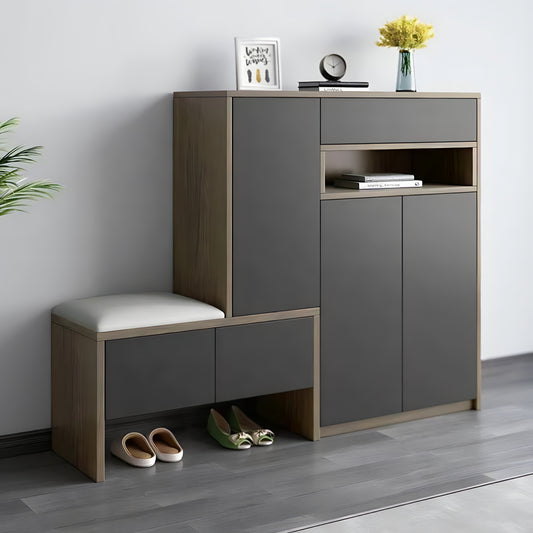 Modern shoe cabinet with storage compartments and a bench on a gray floor.