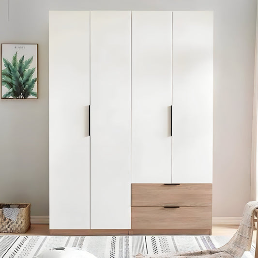 White wardrobe with wooden drawers in a room with a plant and basket on the floor.