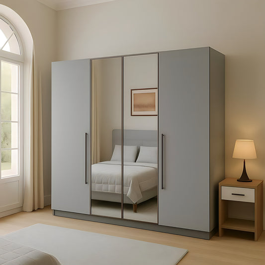 Gray wardrobe with mirror doors in a bedroom setting with a lamp and bed visible.