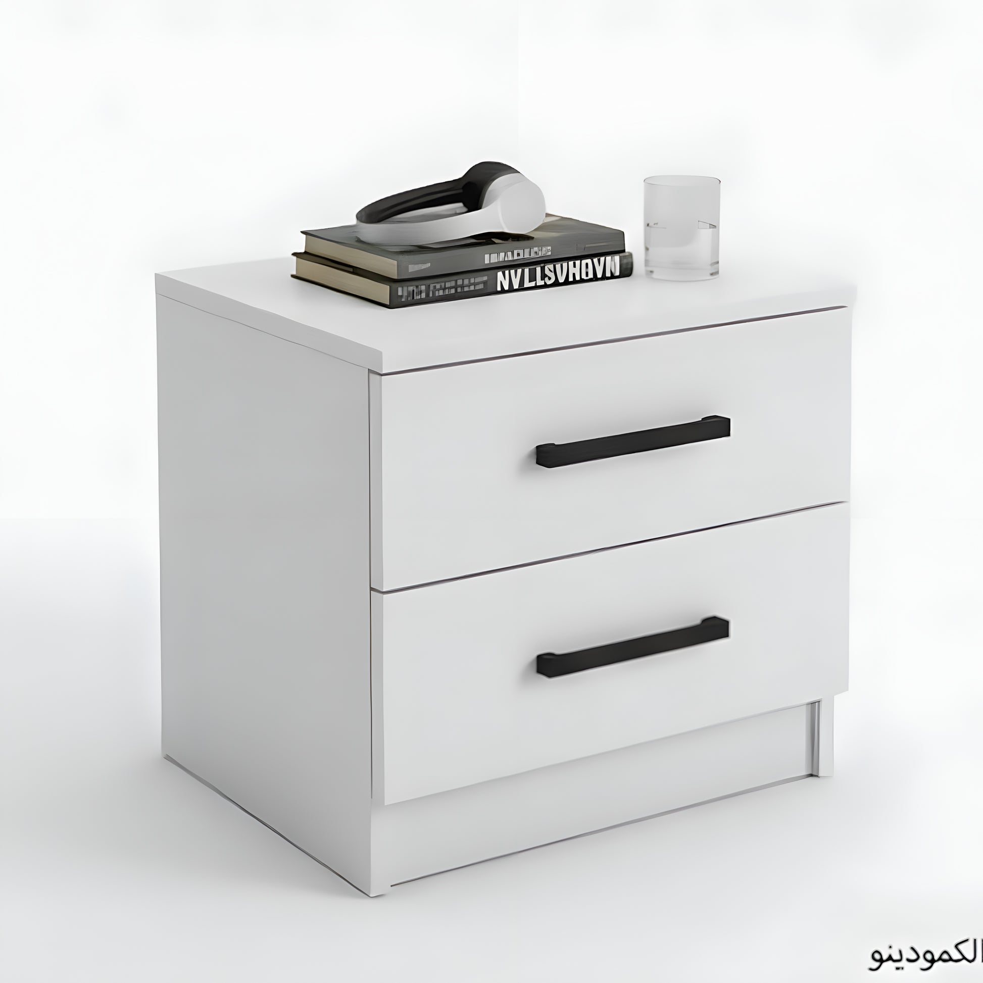 White nightstand with black handles on a white background