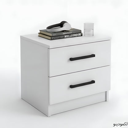 White nightstand with black handles on a white background