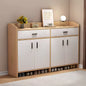 Wooden shoe cabinet with white doors and shoe storage space, placed against a beige wall.