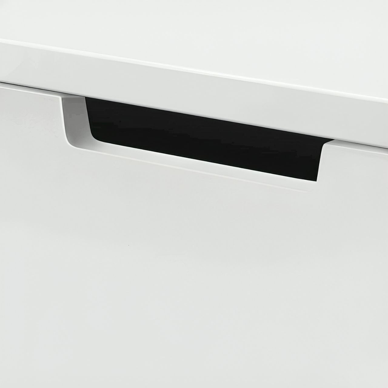 Close-up of a white drawer with a black handle on a light gray background