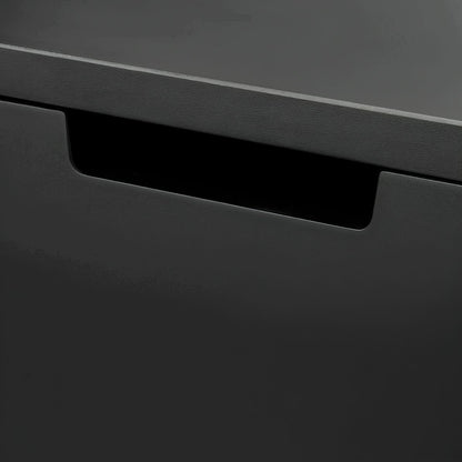 Close-up of a black drawer with a metallic handle on a dark gray background