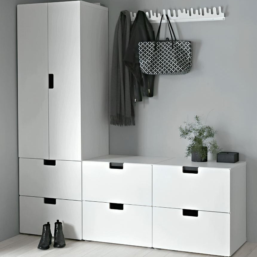 Modern white storage unit with drawers and a coat rack against a gray wall.