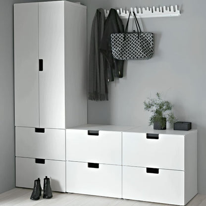 Modern white storage unit with drawers and a coat rack against a gray wall.