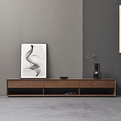 Modern living room with wooden TV stand, abstract art, and vase against a gray wall.