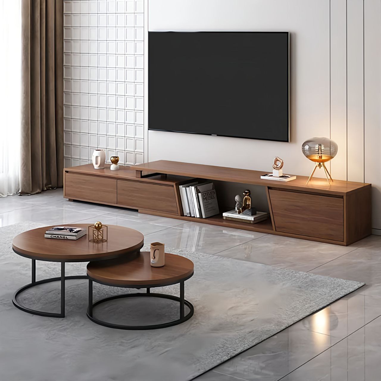 Modern living room with wooden TV stand, round coffee table, and decorative items.
