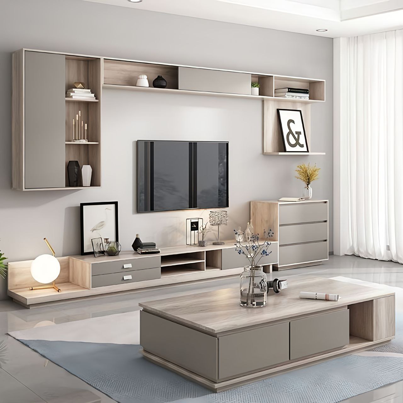 Modern living room with gray wall unit, TV, and coffee table.