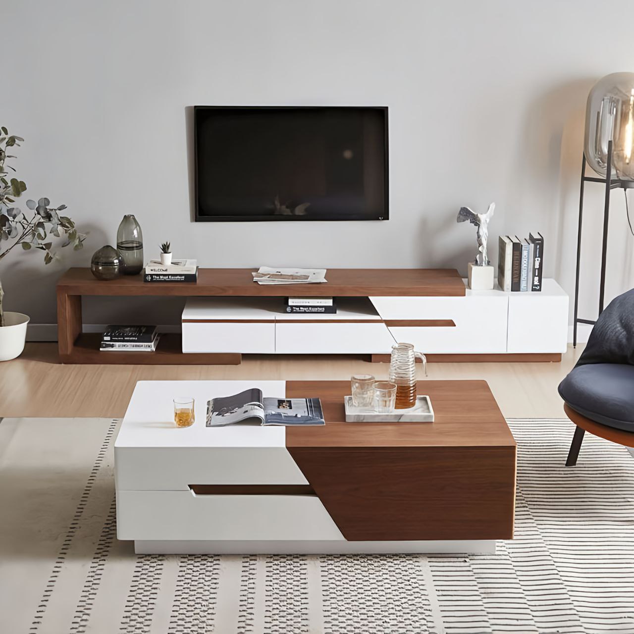 Modern living room with a TV mounted on the wall, wooden coffee table, and decorative items.