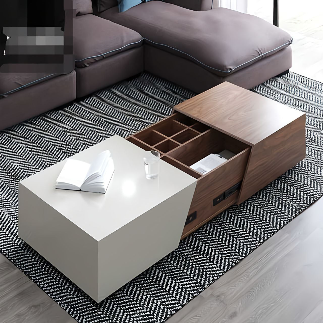 Modern living room with a white coffee table and wooden storage unit.