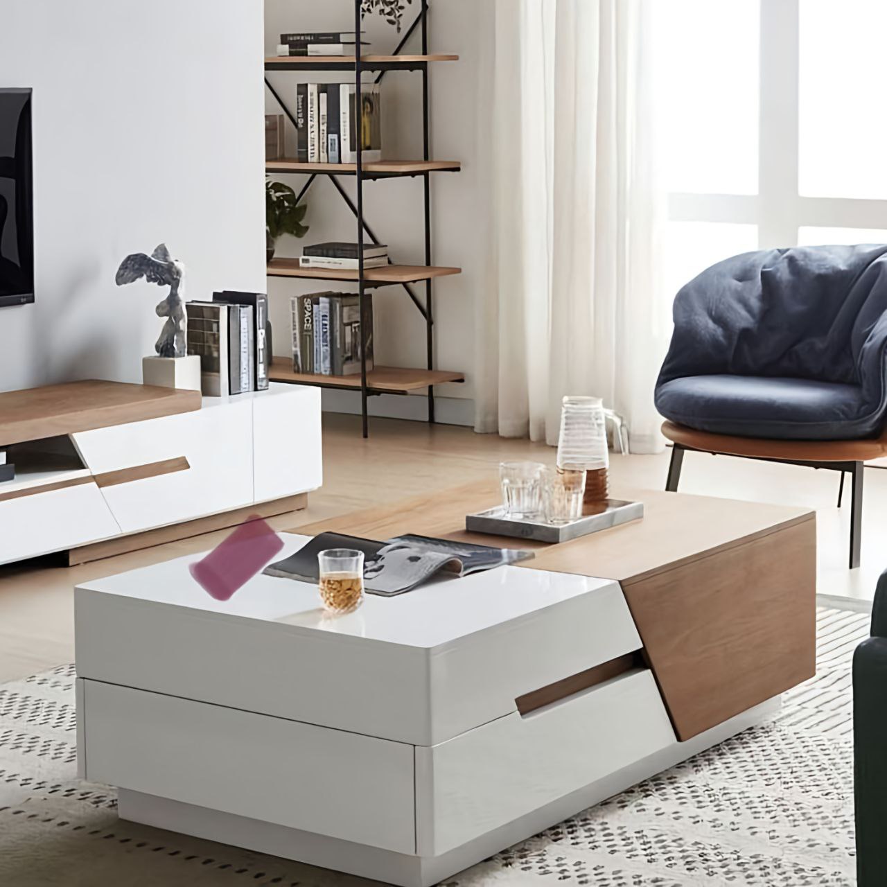 Modern living room with a white and wood coffee table, bookshelf, and chair.