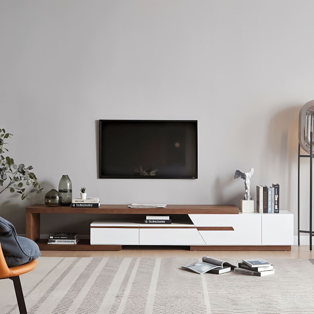 Modern living room with a TV mounted on the wall and a wooden entertainment console.