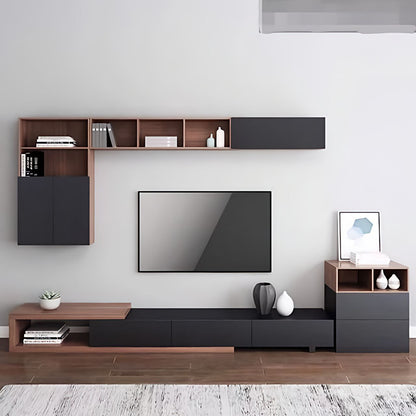 Modern living room with a television and wooden shelves.