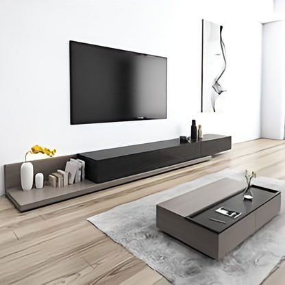 Modern living room with a television and decorative items on a wooden floor.