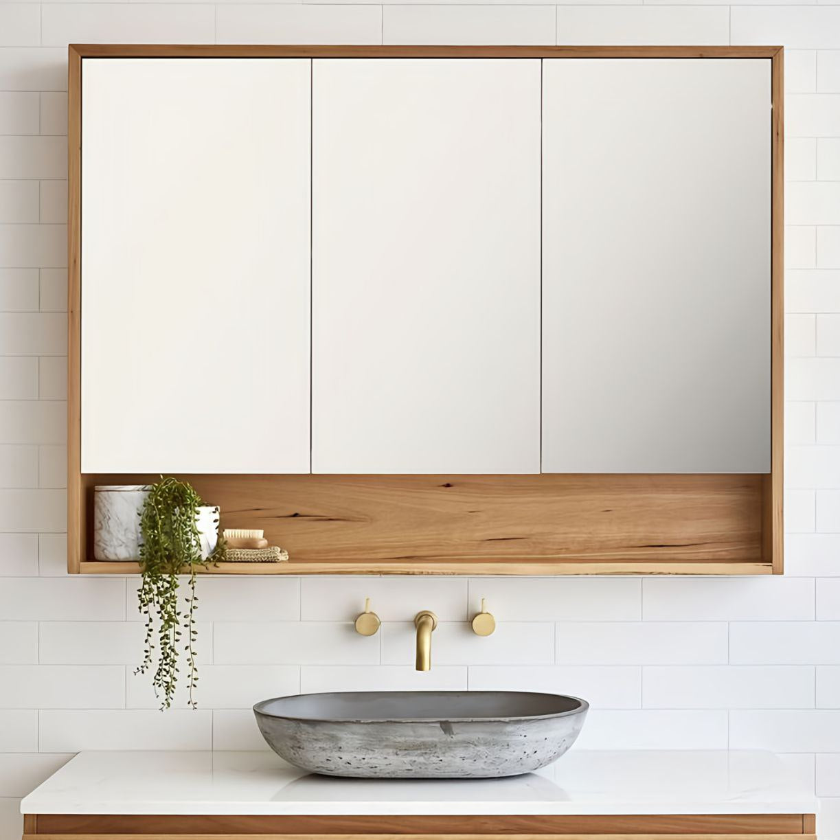 Bathroom with wooden vanity, mirror, and concrete sink.