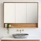 Bathroom with wooden vanity, mirror, and concrete sink.