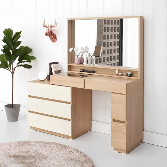 Wooden vanity with mirror and drawers in a room setting.