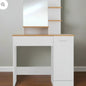 White console table with wooden top against a neutral wall