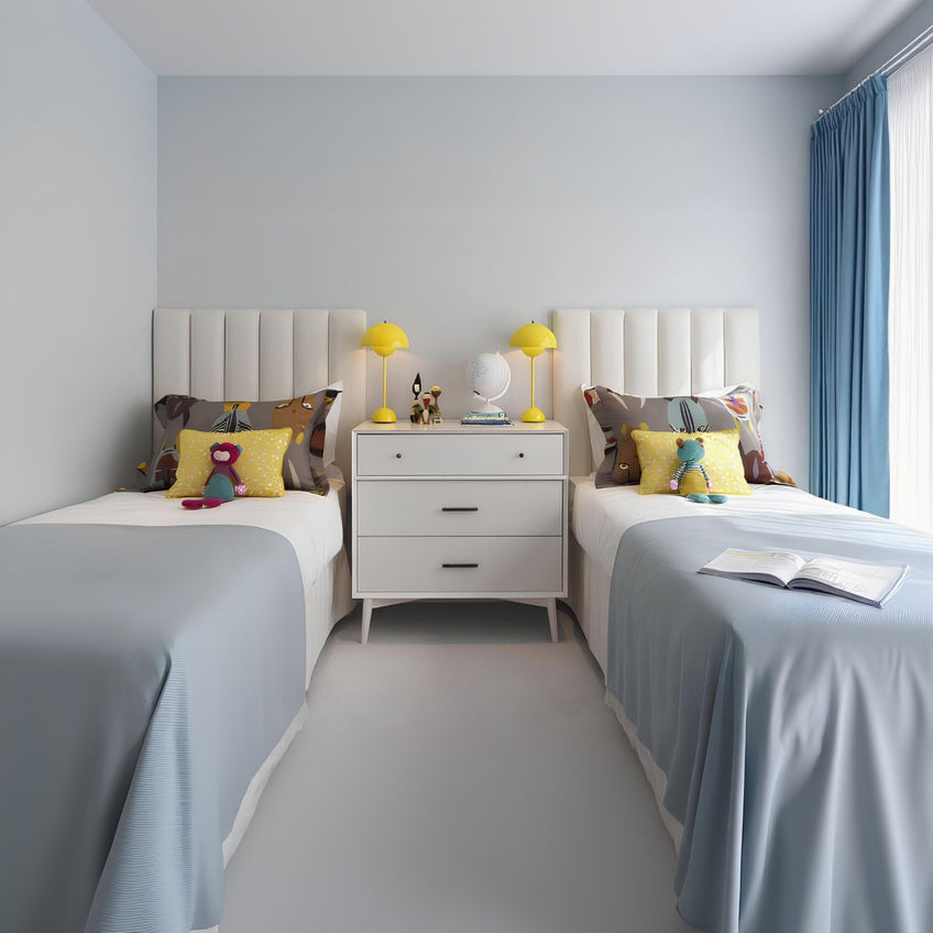 Children's bedroom with two beds, nightstands, and decorative items.