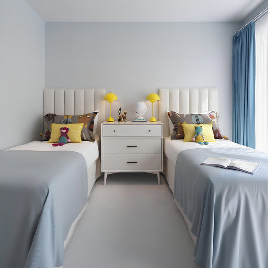 Children's bedroom with two beds, nightstands, and decorative items.