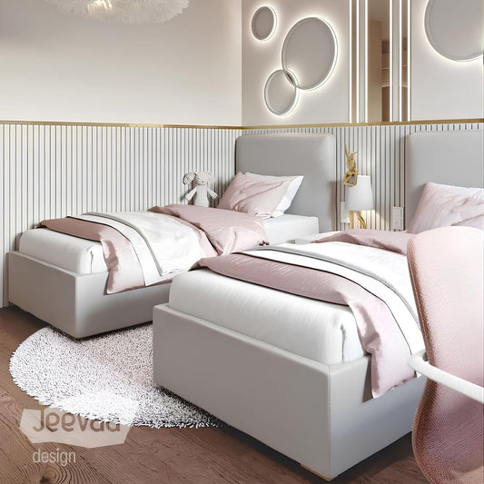 Modern bedroom with two gray beds, pink bedding, and decorative wall lights.