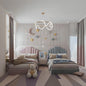 Modern bedroom with two beds, decorative pillows, and a teddy bear.