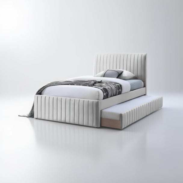 White upholstered bed with striped bedding and a trundle on a white background