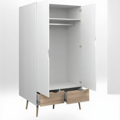 White wardrobe with wooden legs and drawers on a white background